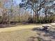 A beautiful picnic area featuring mature trees, picnic tables, and well-maintained landscaping at 1855 Halle Rd, Johns Island, SC 29455