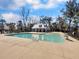 A community pool featuring lounge chairs, a pool house, and well-maintained landscaping at 1855 Halle Rd, Johns Island, SC 29455