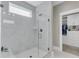 Walk-in shower with glass door and white marble tiles at 1855 Halle Rd, Johns Island, SC 29455