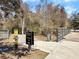 Community walking trail entrance with clear signage, easy access, and a convenient path for outdoor activities at 1855 Halle Rd, Johns Island, SC 29455