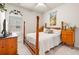 Comfortable bedroom with hardwood furniture, a patterned area rug, and large window with bright sunlight at 187 Granton Edge Ln, Summerville, SC 29486