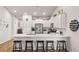 Modern kitchen with white cabinets, a spacious island, stainless steel appliances and decorative nautical décor at 187 Granton Edge Ln, Summerville, SC 29486
