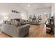 Spacious living room with vaulted ceilings, hardwood floors, comfortable seating, and large windows at 187 Granton Edge Ln, Summerville, SC 29486