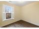 Bedroom featuring hardwood floors and a window with plantation shutters allowing natural light at 1918 Essex Farms Dr, Charleston, SC 29414