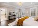 Bedroom with an ensuite bathroom, a view of a balcony, and a modern console table at 1918 Essex Farms Dr, Charleston, SC 29414