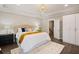 Bright bedroom featuring a comfortable bed, decorative pillows, and a modern light fixture at 1918 Essex Farms Dr, Charleston, SC 29414