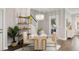 Stylish dining area with modern chandelier, shelving, and easy access to outdoors at 1918 Essex Farms Dr, Charleston, SC 29414