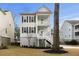 Charming two-story coastal home featuring double porches, shuttered windows, and beautiful landscaping at 1918 Essex Farms Dr, Charleston, SC 29414