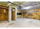Spacious garage with high ceilings, storage racks, and unfinished walls and flooring at 1918 Essex Farms Dr, Charleston, SC 29414