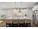 Gourmet kitchen with a spacious island, sleek stainless steel appliances, and pendant lighting at 1918 Essex Farms Dr, Charleston, SC 29414