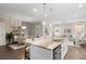 Open kitchen and dining area with large island and breakfast bar, perfect for entertaining and casual meals at 1918 Essex Farms Dr, Charleston, SC 29414