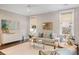 Stylish living room features neutral decor, natural light, and an inviting atmosphere for relaxation at 1918 Essex Farms Dr, Charleston, SC 29414