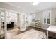 Bright home office space with French doors and a view into the dining room at 1918 Essex Farms Dr, Charleston, SC 29414