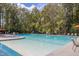 The community pool offers residents a refreshing escape, surrounded by lush greenery and comfort at 1918 Essex Farms Dr, Charleston, SC 29414
