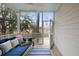 Relaxing screened porch with a swing bed and view of lush surroundings, perfect for outdoor enjoyment at 1918 Essex Farms Dr, Charleston, SC 29414