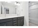 Modern bathroom featuring double sinks, granite counters, sleek cabinetry, and an adjacent shower and toilet room at 211 Abercom Place Dr, Moncks Corner, SC 29461