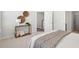 Bright bedroom featuring neutral décor, decorative wall hangings, and open doorway to the home's staircase at 211 Abercom Place Dr, Moncks Corner, SC 29461