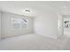 Spacious bonus room with a large window for natural light and plush carpeting at 211 Abercom Place Dr, Moncks Corner, SC 29461