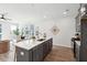 Open-concept kitchen featuring a large island, stainless steel appliances, and hardwood floors at 211 Abercom Place Dr, Moncks Corner, SC 29461