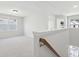 Bright and airy loft area featuring neutral carpet and trim and plenty of natural light at 211 Abercom Place Dr, Moncks Corner, SC 29461