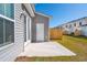Back patio with view of fenced yard and exterior door of home at 211 Abercom Place Dr, Moncks Corner, SC 29461