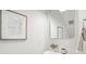 Stylish powder room with elegant mirror, modern fixtures, and decorative artwork at 211 Abercom Place Dr, Moncks Corner, SC 29461