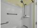 Bathroom with shower and chrome fixtures, a white shower stall, and a yellow ceiling at 201 Maple Dr, Summerville, SC 29485