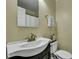 Bathroom featuring a white vanity sink, commode, and a mirrored medicine cabinet at 201 Maple Dr, Summerville, SC 29485