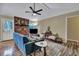 Cozy living room featuring a brick fireplace, ceiling fan, and comfortable seating at 201 Maple Dr, Summerville, SC 29485
