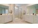 Luxurious bathroom with double vanities, tiled shower, and modern fixtures at 202 Belfort Pl, Summerville, SC 29486