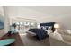Beautiful main bedroom with a lake view, blue accents, and sitting area at 202 Belfort Pl, Summerville, SC 29486