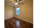 Comfortable bedroom with hardwood floors, neutral walls, and a bright window at 2100 Booker St, Charleston, SC 29405