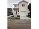 Charming two-story home with a spacious front yard and a convenient attached garage at 2100 Booker St, Charleston, SC 29405