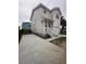 A bright two-story home featuring a covered entryway and a long driveway for ample parking at 2100 Booker St, Charleston, SC 29405