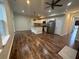 Bright kitchen and living space combination with an island and stainless steel appliances at 2100 Booker St, Charleston, SC 29405