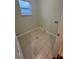 Laundry room featuring tile floors, neutral walls, utility hook-ups, and a window with natural light at 2100 Booker St, Charleston, SC 29405