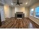 Inviting living room with beautiful flooring, fireplace, and windows letting in natural light at 2100 Booker St, Charleston, SC 29405
