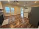 Combined living space features wood flooring, a fireplace, and a sliding door to the outside at 2100 Booker St, Charleston, SC 29405