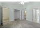 A spacious bedroom with light green walls and three closets/doorways at 2333 Tall Sail Dr # G 607, Charleston, SC 29414