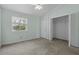 Bedroom with light green walls, a closet, window and carpeted floor at 2333 Tall Sail Dr # G 607, Charleston, SC 29414