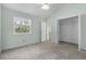 Bedroom with light green walls, a closet, window and carpeted floor at 2333 Tall Sail Dr # G 607, Charleston, SC 29414
