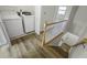 Upstairs laundry room with white washer and dryer, a door to the staircase and hallway at 2333 Tall Sail Dr # G 607, Charleston, SC 29414