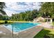 A full shot of the community pool, complete with sundeck, landscaping, and clubhouse at 2333 Tall Sail Dr # G 607, Charleston, SC 29414