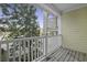 A quaint outdoor porch with white railings and wood flooring and exterior yellow siding at 2333 Tall Sail Dr # G 607, Charleston, SC 29414