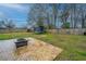 Large backyard with stamped concrete patio, fire pit, trampoline and ample space for outdoor activities at 240 Horseshoe Dr, Goose Creek, SC 29445