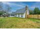 Spacious backyard featuring a newly-installed fence, patio, and grassy lawn, great for recreation and relaxation at 240 Horseshoe Dr, Goose Creek, SC 29445