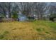 Spacious backyard with a shed and trampoline provides ample room for outdoor activities and storage at 240 Horseshoe Dr, Goose Creek, SC 29445