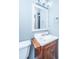 Bathroom featuring standard toilet and sink with wood cabinets at 240 Horseshoe Dr, Goose Creek, SC 29445