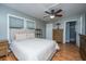 Spacious bedroom with a ceiling fan, natural light, and wood floors at 240 Horseshoe Dr, Goose Creek, SC 29445