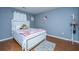 Bedroom with white comforter, wood flooring, gray walls, and plush rug at 240 Horseshoe Dr, Goose Creek, SC 29445